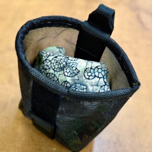 Bucket Dump Pouch in black mesh fabric.