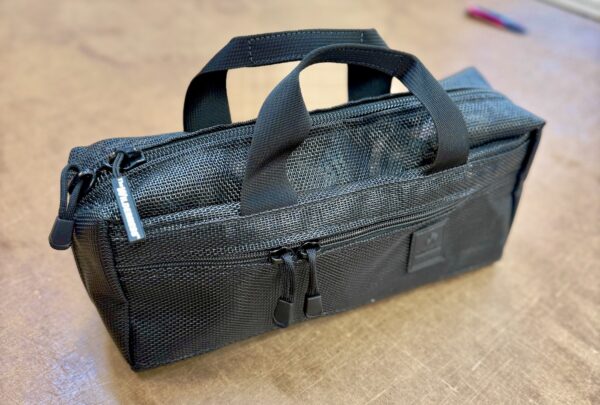 Giles Bag in black mesh fabric.